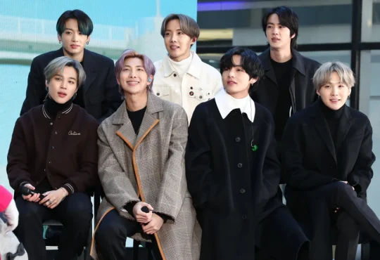 BTS members performing live during the Permission to Dance On Stage concert, featured in the new live album