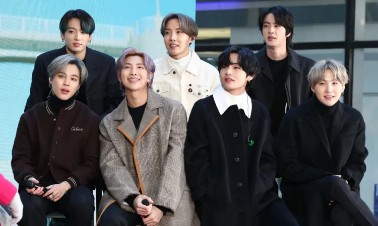 BTS members performing live during the Permission to Dance On Stage concert, featured in the new live album