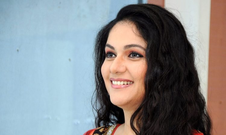 Gracy Singh smiling at a public event, reflecting on her Bollywood career and spiritual journey