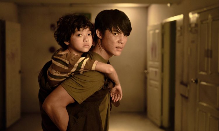 Scene from Netflix's new zombie movie showing intense hallway combat, blending horror and action like 28 Years Later and The Raid