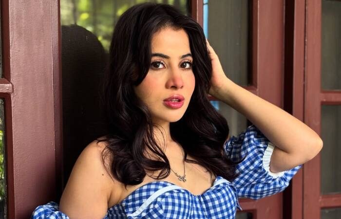 Uorfi Javed showing her natural face after lip filler removal in a blue skater dress