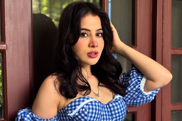 Uorfi Javed showing her natural face after lip filler removal in a blue skater dress