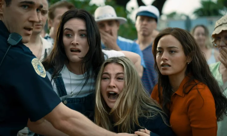 Cast of I Know What You Did Last Summer standing on Southport boardwalk in horror movie scene