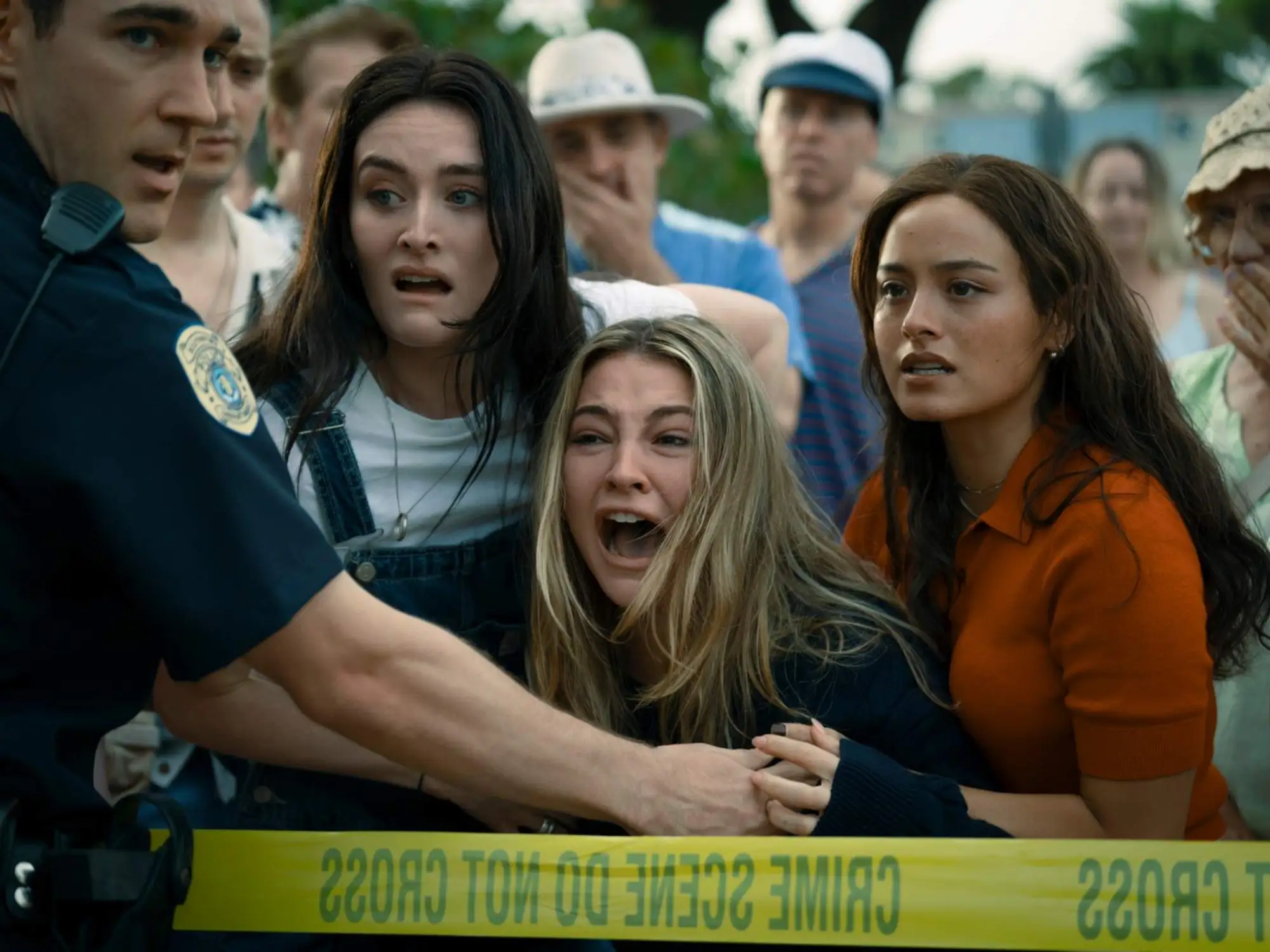 Cast of I Know What You Did Last Summer standing on Southport boardwalk in horror movie scene