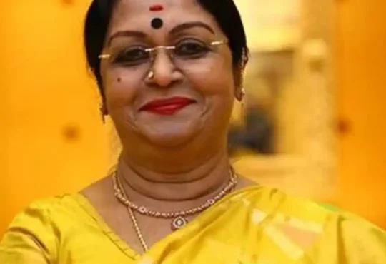 B. Saroja Devi smiling in a traditional saree during a public event – South Indian cinema legend