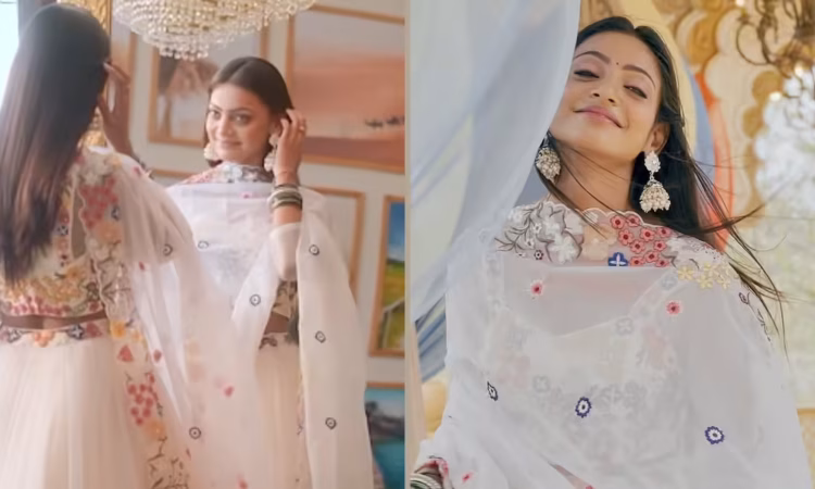 Mahakumbh actress Monalisa posing elegantly in a white lehenga, showcasing her viral fashion look