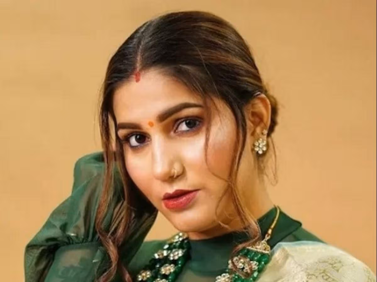 Sapna Choudhary performing on stage during Chittorgarh show with collapsed dome in background