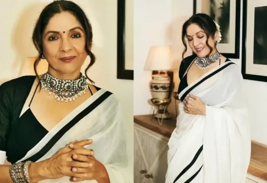 Neena Gupta in a bold outfit smiling confidently at a public event with Masaba Gupta