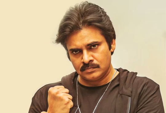 Pawan Kalyan wielding a sword during OG pre-release event, narrowly missing bodyguard