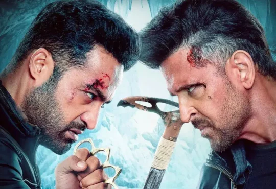 War 2 movie poster featuring Jr NTR, Hrithik Roshan, and Kiara Advani