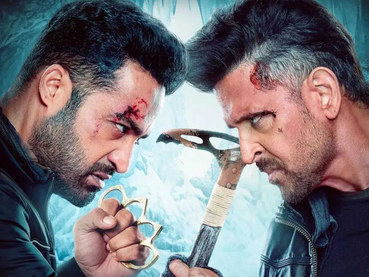 War 2 movie poster featuring Jr NTR, Hrithik Roshan, and Kiara Advani