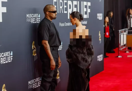 Bianca Censori posing on the red carpet in a bold minimalist outfit