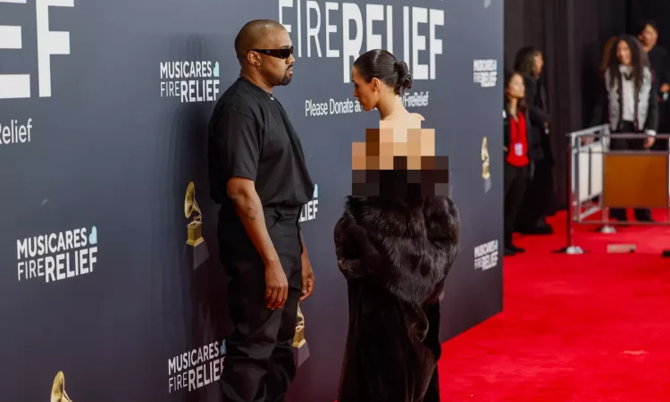 Bianca Censori posing on the red carpet in a bold minimalist outfit