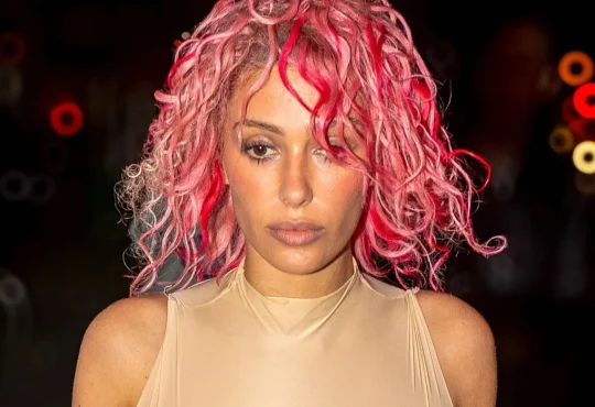 Bianca Censori posing in a minimalist fashion look representing her celebrity style