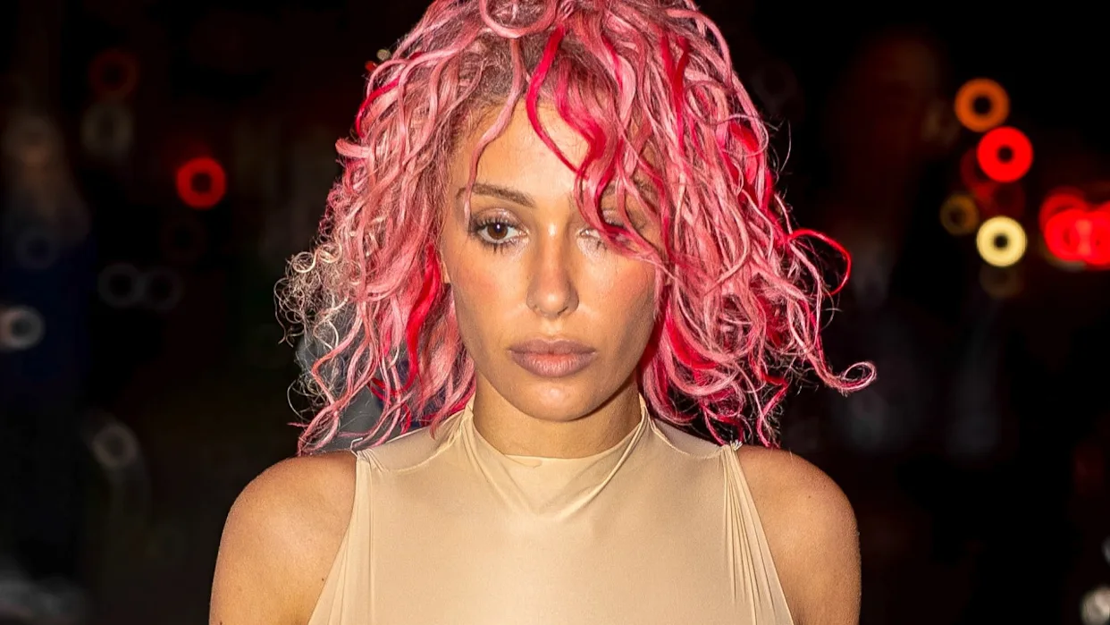 Bianca Censori posing in a minimalist fashion look representing her celebrity style