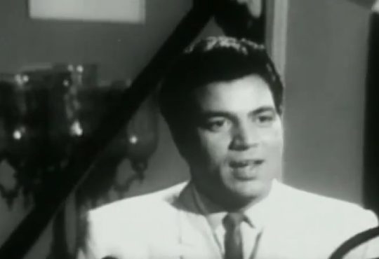 Dharmendra smiling on film set after performing dangerous stunt with Prem Chopra nearby