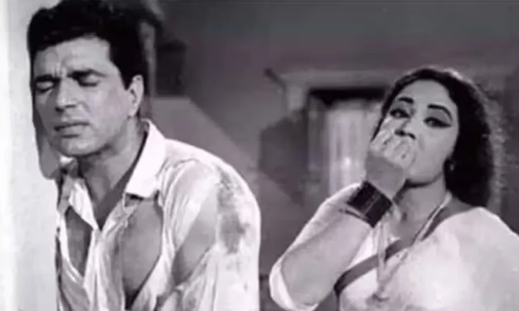 Dharmendra and Meena Kumari together on a classic Bollywood film set
