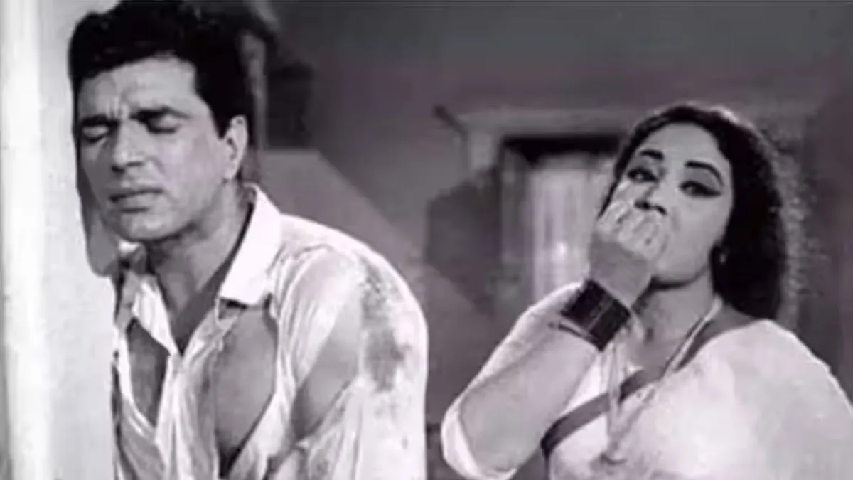 Dharmendra and Meena Kumari together on a classic Bollywood film set
