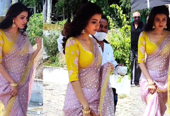 Kajal Agarwal smiling during a candid moment on a movie set