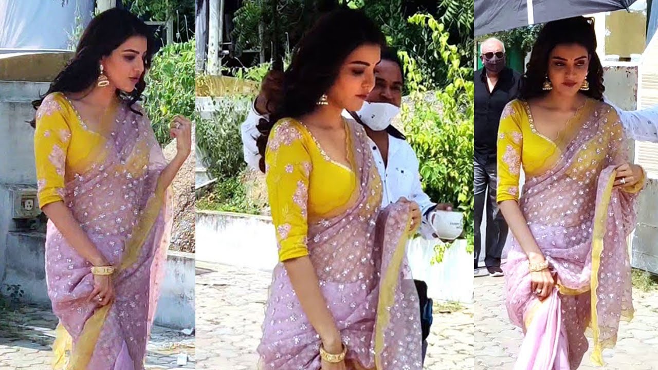 Kajal Agarwal smiling during a candid moment on a movie set