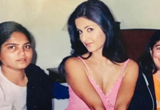 Katrina Kaif smiling during a behind-the-scenes moment on a movie set