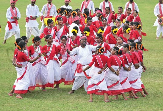 Assamese girls performing traditional Bihu dance celebrating Assamese culture