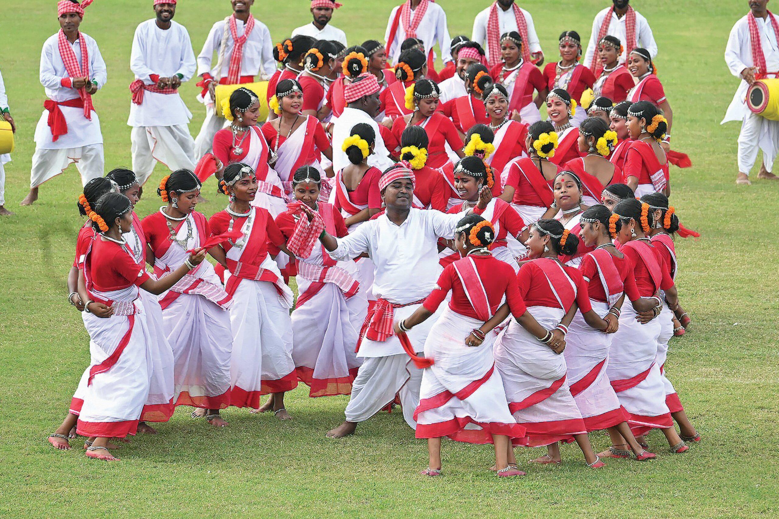 Assamese girls performing traditional Bihu dance celebrating Assamese culture